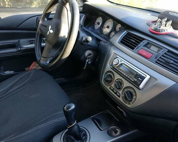 Синій Міцубісі Lancer, об'ємом двигуна 1.58 л та пробігом 317 тис. км за 3600 $, фото 1 на Automoto.ua