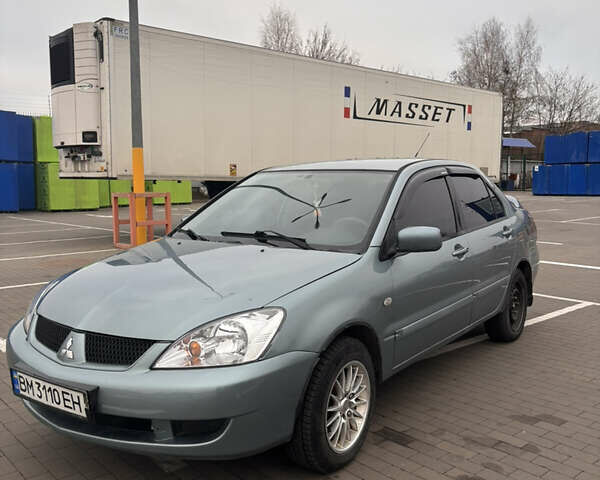 Синий Мицубиси Лансер, объемом двигателя 1.6 л и пробегом 238 тыс. км за 3500 $, фото 1 на Automoto.ua