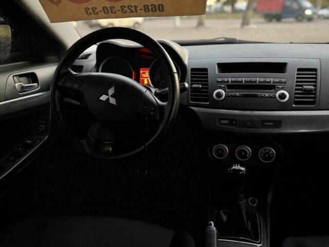 Синій Міцубісі Lancer, об'ємом двигуна 2 л та пробігом 189 тис. км за 7350 $, фото 17 на Automoto.ua