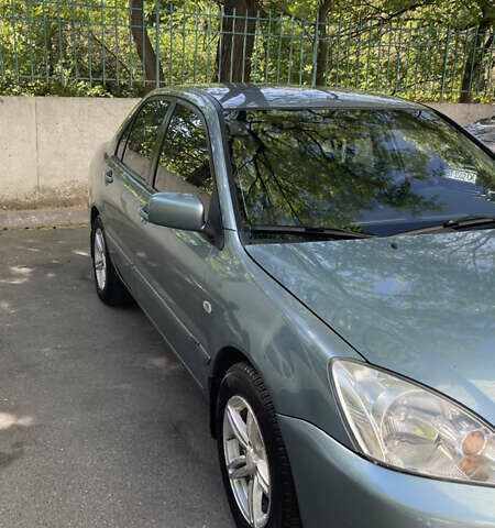 Синій Міцубісі Lancer, об'ємом двигуна 1.58 л та пробігом 210 тис. км за 5300 $, фото 2 на Automoto.ua