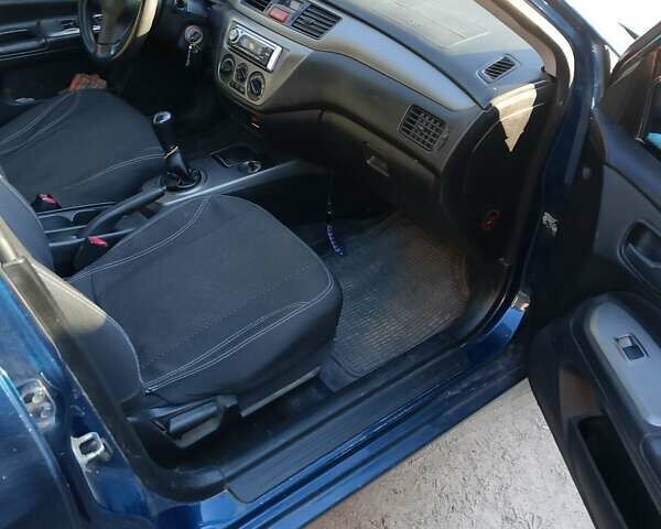 Синій Міцубісі Lancer, об'ємом двигуна 1.58 л та пробігом 317 тис. км за 3600 $, фото 4 на Automoto.ua
