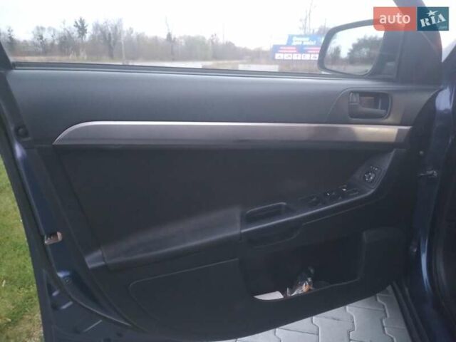 Синий Мицубиси Лансер, объемом двигателя 1.5 л и пробегом 260 тыс. км за 5000 $, фото 13 на Automoto.ua