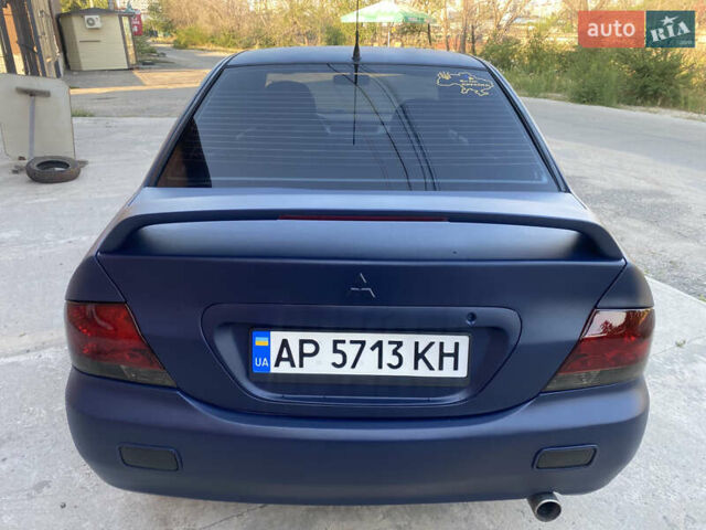 Синий Мицубиси Лансер, объемом двигателя 2 л и пробегом 100 тыс. км за 4999 $, фото 6 на Automoto.ua