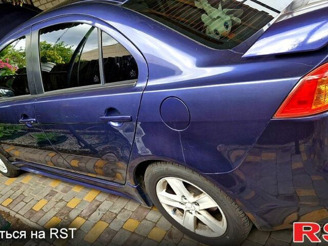 Синій Міцубісі Lancer, об'ємом двигуна 2 л та пробігом 248 тис. км за 5000 $, фото 7 на Automoto.ua