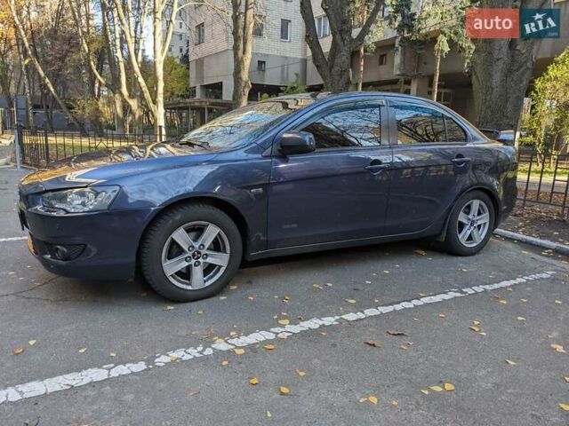 Синий Мицубиси Лансер, объемом двигателя 2 л и пробегом 300 тыс. км за 6250 $, фото 3 на Automoto.ua