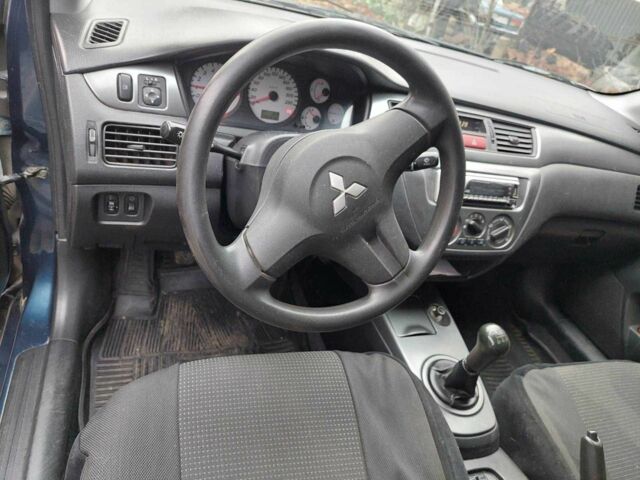 Синий Мицубиси Лансер, объемом двигателя 1.6 л и пробегом 87 тыс. км за 7000 $, фото 7 на Automoto.ua