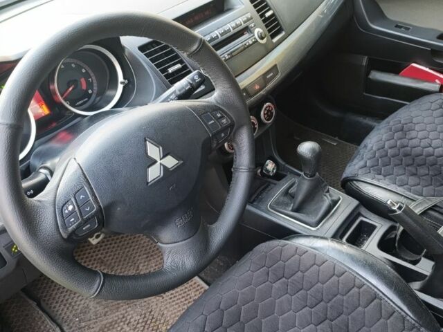 Міцубісі Lancer 2007 у Кременчуге на Automoto.ua Синій Міцубісі Lancer, об'ємом двигуна 2 л та пробігом 160 тис. км за 6500 $, фото 12 на Automoto.ua