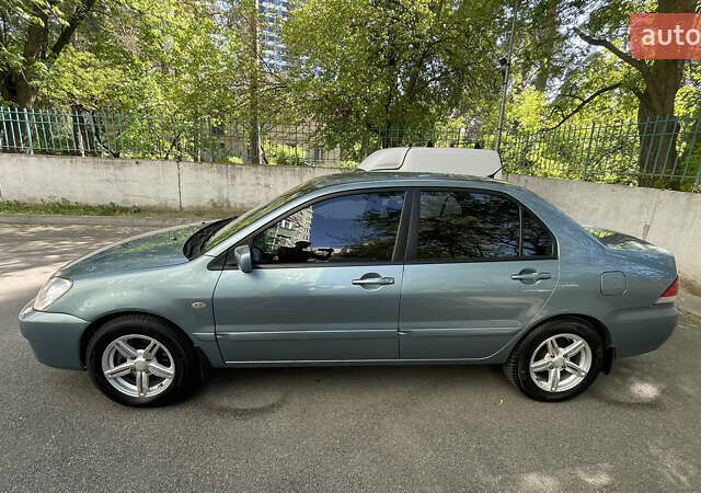 Синій Міцубісі Lancer, об'ємом двигуна 1.58 л та пробігом 210 тис. км за 5300 $, фото 4 на Automoto.ua