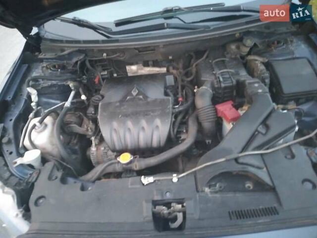 Синий Мицубиси Лансер, объемом двигателя 1.5 л и пробегом 260 тыс. км за 5000 $, фото 19 на Automoto.ua