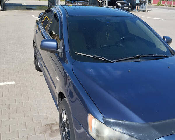 Синий Мицубиси Лансер, объемом двигателя 2 л и пробегом 231 тыс. км за 6800 $, фото 3 на Automoto.ua