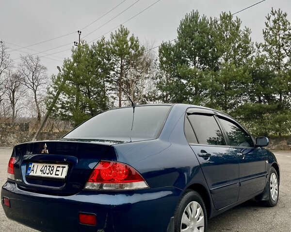 Синий Мицубиси Лансер, объемом двигателя 1.6 л и пробегом 185 тыс. км за 4950 $, фото 10 на Automoto.ua