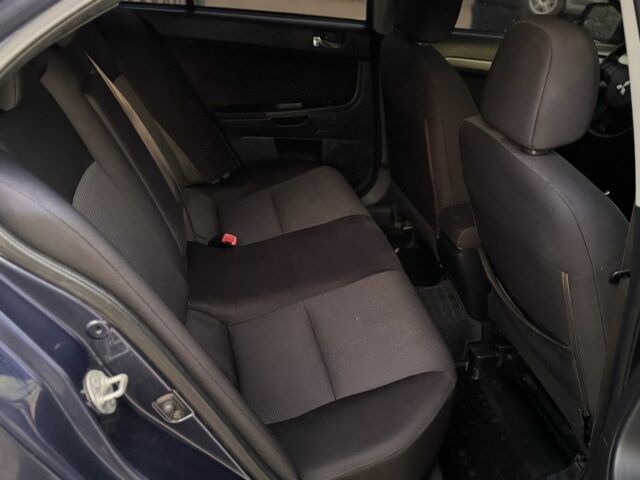 Синій Міцубісі Lancer, об'ємом двигуна 2 л та пробігом 189 тис. км за 7350 $, фото 16 на Automoto.ua