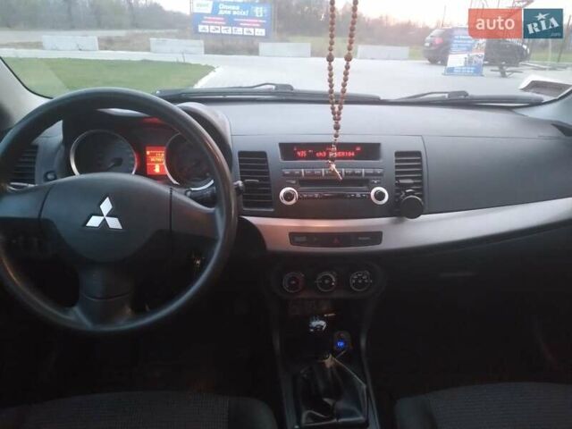 Синий Мицубиси Лансер, объемом двигателя 1.5 л и пробегом 260 тыс. км за 5000 $, фото 18 на Automoto.ua