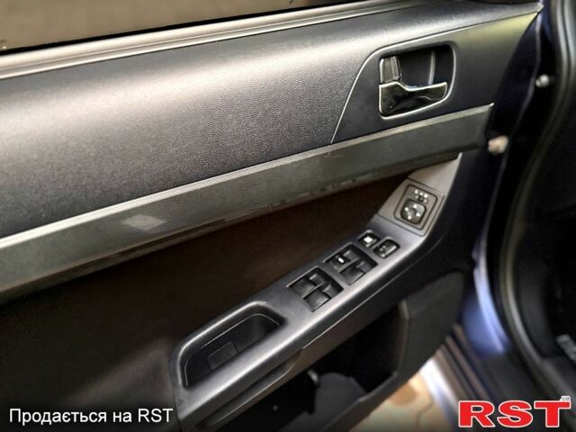 Синий Мицубиси Лансер, объемом двигателя 2 л и пробегом 189 тыс. км за 7350 $, фото 1 на Automoto.ua