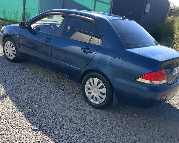 Синій Міцубісі Lancer, об'ємом двигуна 1.58 л та пробігом 317 тис. км за 3600 $, фото 10 на Automoto.ua
