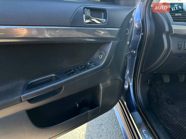 Синій Міцубісі Lancer, об'ємом двигуна 2 л та пробігом 240 тис. км за 6800 $, фото 7 на Automoto.ua