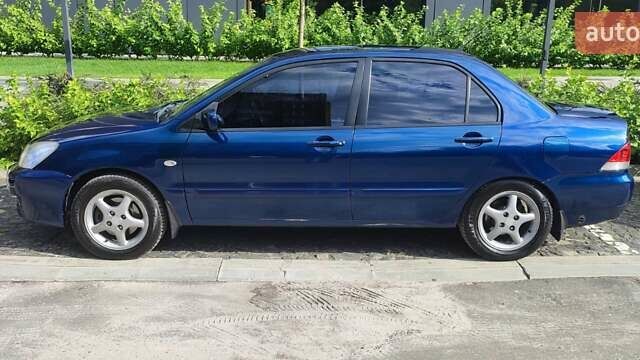Синій Міцубісі Lancer, об'ємом двигуна 1.6 л та пробігом 198 тис. км за 4800 $, фото 5 на Automoto.ua