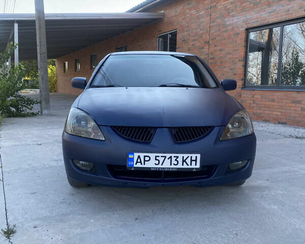 Синий Мицубиси Лансер, объемом двигателя 2 л и пробегом 100 тыс. км за 4999 $, фото 1 на Automoto.ua