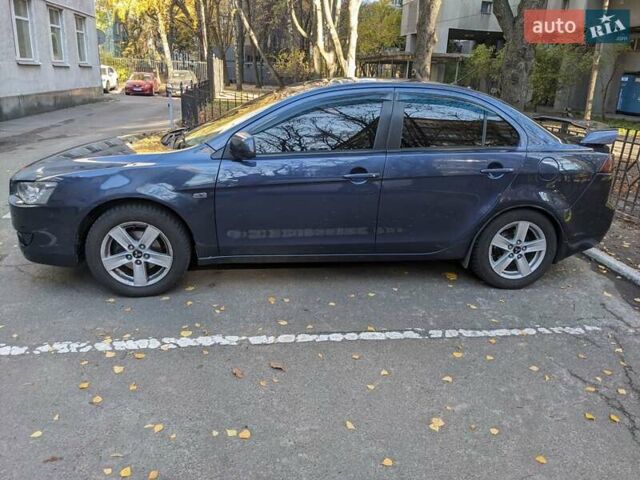 Синий Мицубиси Лансер, объемом двигателя 2 л и пробегом 300 тыс. км за 6250 $, фото 6 на Automoto.ua