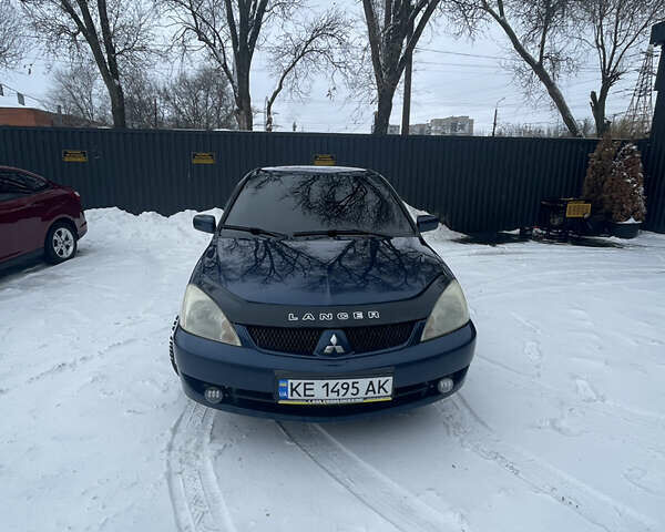 Синий Мицубиси Лансер, объемом двигателя 1.58 л и пробегом 319 тыс. км за 3700 $, фото 1 на Automoto.ua