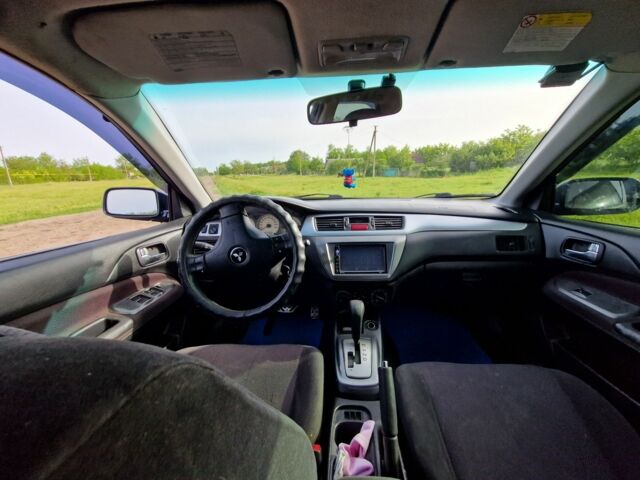 Синий Мицубиси Лансер, объемом двигателя 2 л и пробегом 260 тыс. км за 4200 $, фото 3 на Automoto.ua