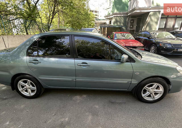 Синій Міцубісі Lancer, об'ємом двигуна 1.58 л та пробігом 210 тис. км за 5300 $, фото 3 на Automoto.ua