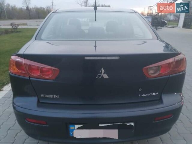 Синий Мицубиси Лансер, объемом двигателя 1.5 л и пробегом 260 тыс. км за 5000 $, фото 4 на Automoto.ua