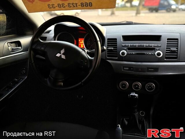Синий Мицубиси Лансер, объемом двигателя 2 л и пробегом 189 тыс. км за 7350 $, фото 5 на Automoto.ua