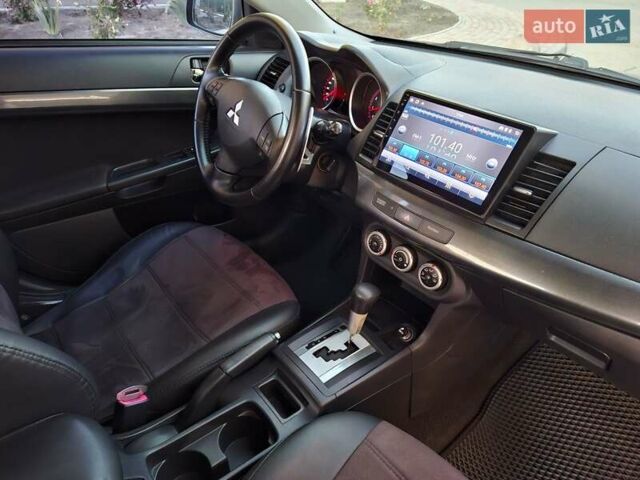 Синій Міцубісі Lancer, об'ємом двигуна 2 л та пробігом 234 тис. км за 6700 $, фото 19 на Automoto.ua