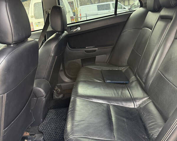 Синий Мицубиси Лансер, объемом двигателя 2 л и пробегом 326 тыс. км за 5650 $, фото 10 на Automoto.ua