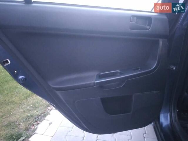 Синий Мицубиси Лансер, объемом двигателя 1.5 л и пробегом 260 тыс. км за 5000 $, фото 12 на Automoto.ua