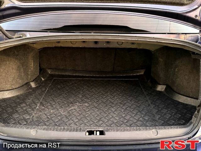 Синий Мицубиси Лансер, объемом двигателя 2 л и пробегом 189 тыс. км за 7350 $, фото 4 на Automoto.ua