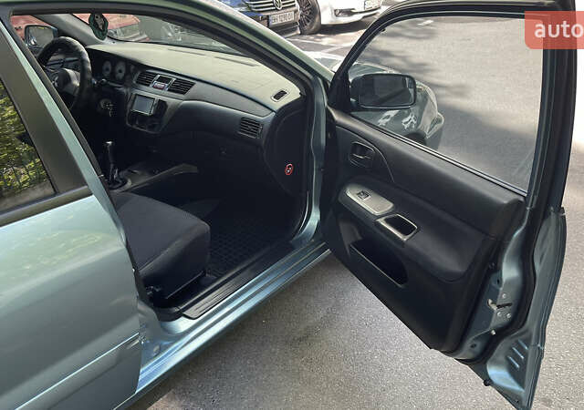 Синій Міцубісі Lancer, об'ємом двигуна 1.58 л та пробігом 210 тис. км за 5300 $, фото 7 на Automoto.ua
