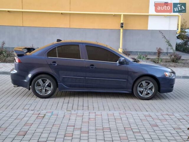 Синій Міцубісі Lancer, об'ємом двигуна 2 л та пробігом 234 тис. км за 6700 $, фото 7 на Automoto.ua