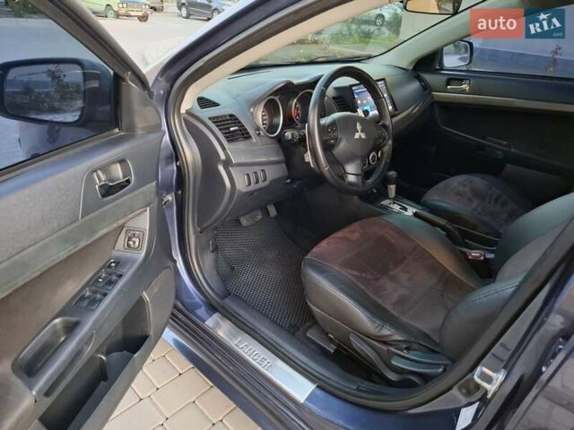 Синій Міцубісі Lancer, об'ємом двигуна 2 л та пробігом 234 тис. км за 6700 $, фото 16 на Automoto.ua