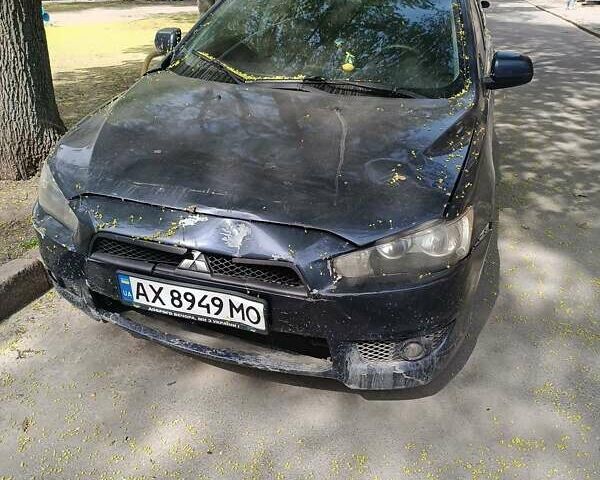 Синій Міцубісі Lancer, об'ємом двигуна 2 л та пробігом 154 тис. км за 5000 $, фото 6 на Automoto.ua