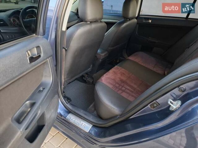 Синій Міцубісі Lancer, об'ємом двигуна 2 л та пробігом 234 тис. км за 6700 $, фото 13 на Automoto.ua