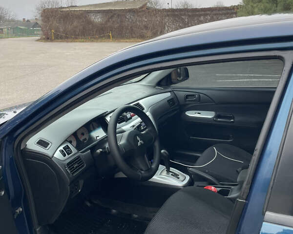 Синий Мицубиси Лансер, объемом двигателя 1.6 л и пробегом 185 тыс. км за 4950 $, фото 18 на Automoto.ua