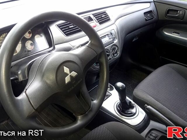 Синий Мицубиси Лансер, объемом двигателя 1.6 л и пробегом 274 тыс. км за 2700 $, фото 5 на Automoto.ua