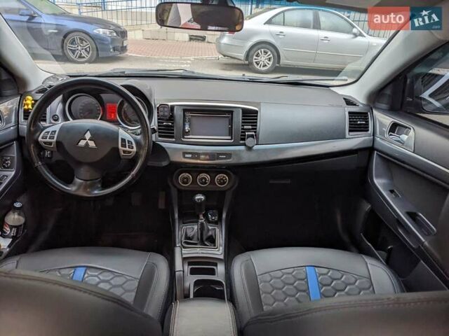 Синий Мицубиси Лансер, объемом двигателя 2 л и пробегом 300 тыс. км за 6250 $, фото 11 на Automoto.ua