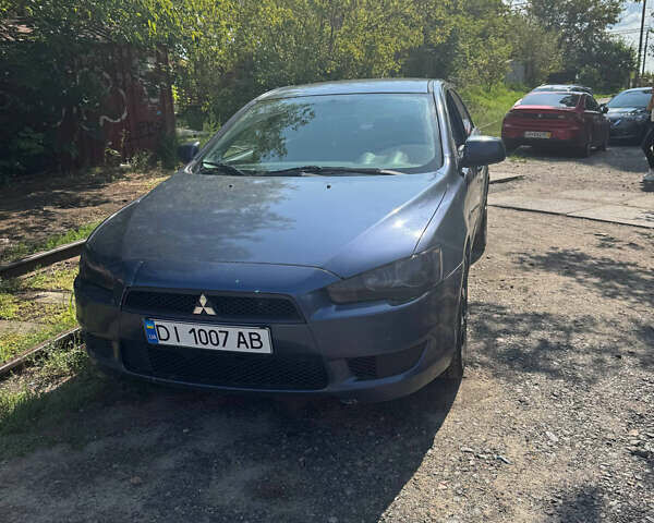 Синий Мицубиси Лансер, объемом двигателя 1.47 л и пробегом 250 тыс. км за 4500 $, фото 1 на Automoto.ua