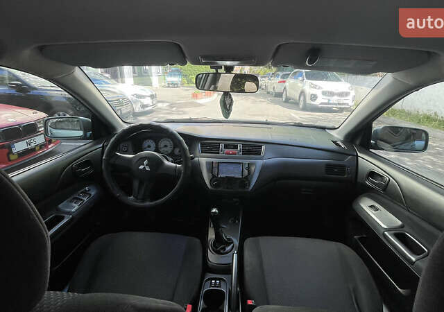 Синій Міцубісі Lancer, об'ємом двигуна 1.58 л та пробігом 210 тис. км за 5300 $, фото 10 на Automoto.ua