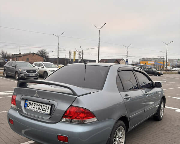 Синий Мицубиси Лансер, объемом двигателя 1.6 л и пробегом 238 тыс. км за 3500 $, фото 3 на Automoto.ua