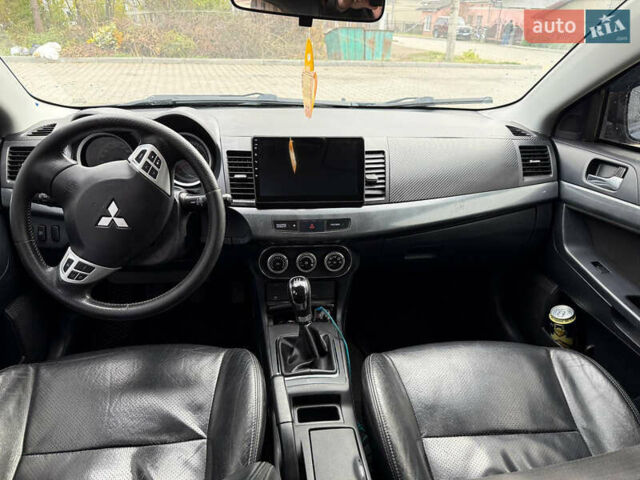 Синий Мицубиси Лансер, объемом двигателя 2 л и пробегом 326 тыс. км за 5650 $, фото 11 на Automoto.ua