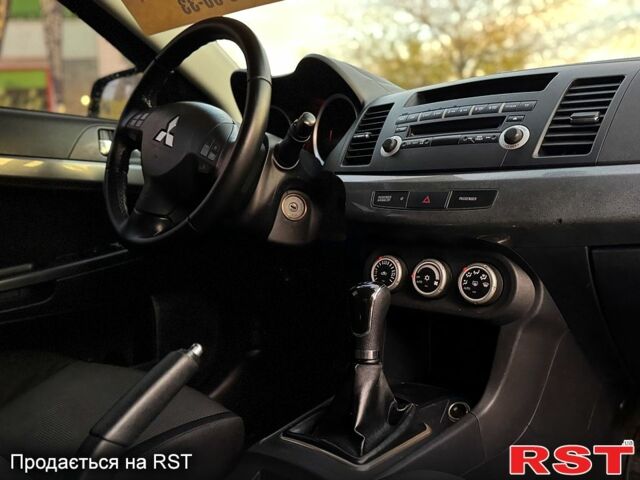 Синий Мицубиси Лансер, объемом двигателя 2 л и пробегом 189 тыс. км за 7350 $, фото 6 на Automoto.ua