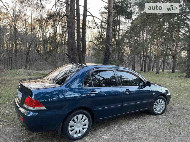 Синій Міцубісі Lancer, об'ємом двигуна 1.6 л та пробігом 176 тис. км за 6300 $, фото 6 на Automoto.ua