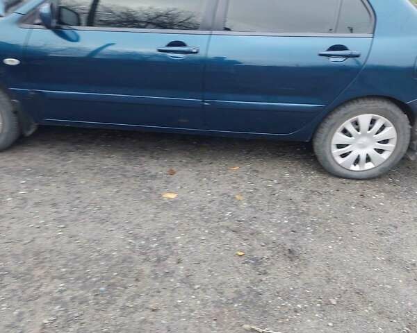 Синий Мицубиси Лансер, объемом двигателя 1.6 л и пробегом 87 тыс. км за 6800 $, фото 4 на Automoto.ua