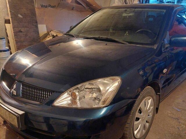 Синий Мицубиси Лансер, объемом двигателя 1.6 л и пробегом 87 тыс. км за 7000 $, фото 5 на Automoto.ua