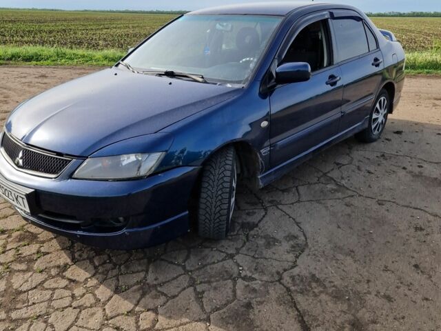 Синий Мицубиси Лансер, объемом двигателя 2 л и пробегом 260 тыс. км за 4200 $, фото 9 на Automoto.ua