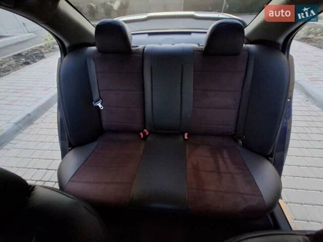 Синій Міцубісі Lancer, об'ємом двигуна 2 л та пробігом 234 тис. км за 6700 $, фото 12 на Automoto.ua